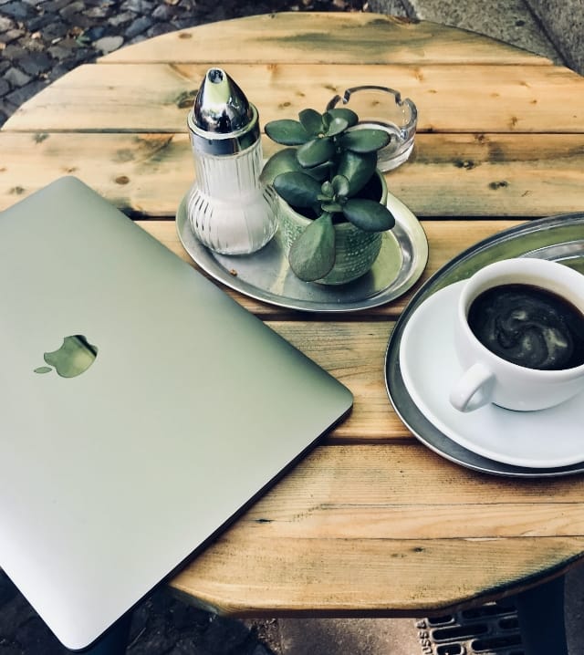 image of a laptop and coffee on a table